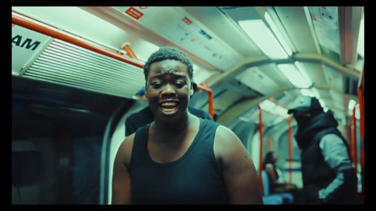 A still from the official “Slap Me Again” video.